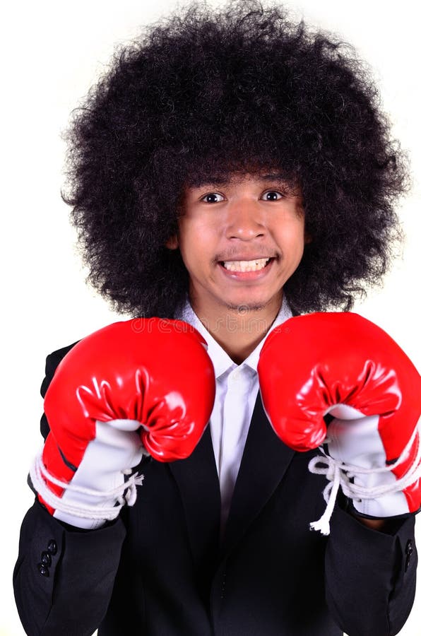 Businessman and hand boxing glove ready to fight. stock photos Businessman and hand boxing glove ready to fight. stock photos