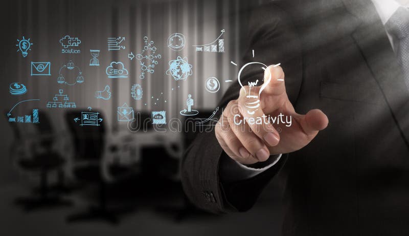 Businessman hand draws lightbulb with new computer interface stock photos