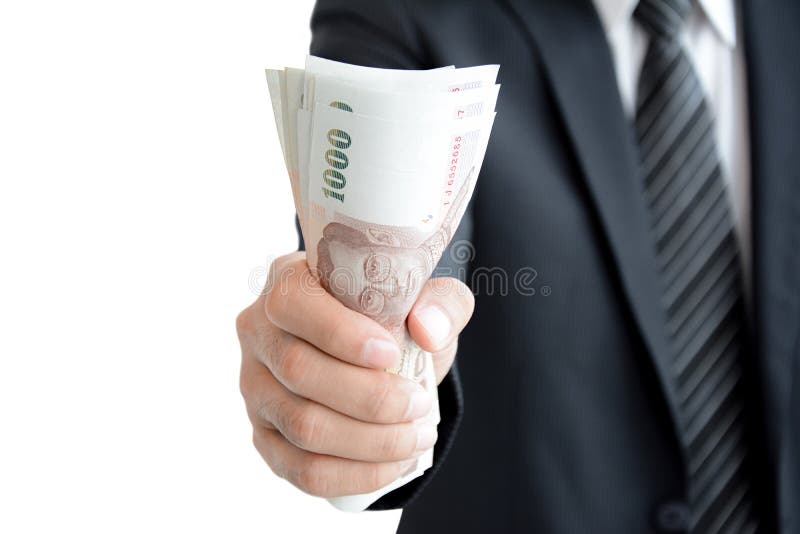 Businessman hand grabbing money, Thai Baht (THB)