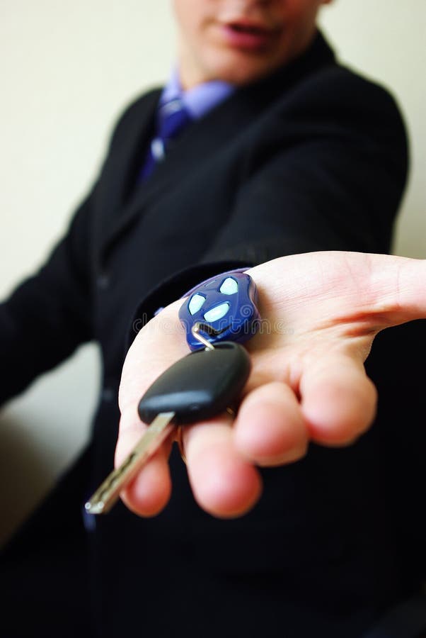 Businessman hand with keys stock image