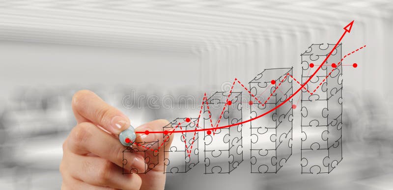 Businessman hand puzzle charts with new modern computer royalty free stock photography