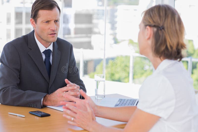 Businessman Having a Discussion with a Job Applicant Stock Image