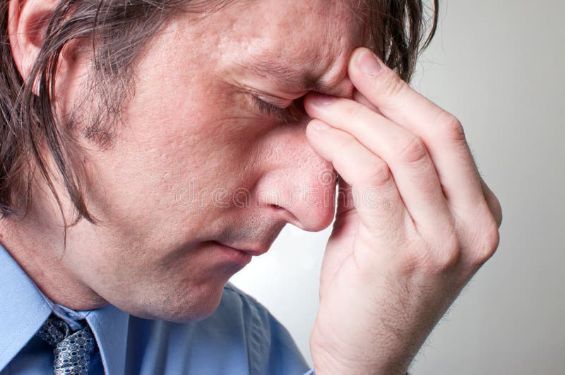 Businessman with headache royalty free stock photos