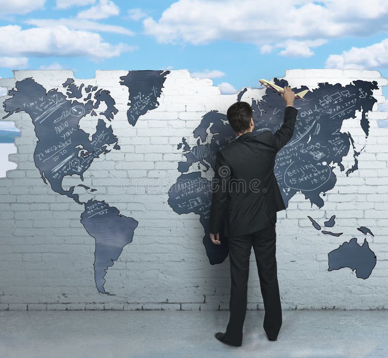 Businessman holding airplane royalty free stock photo