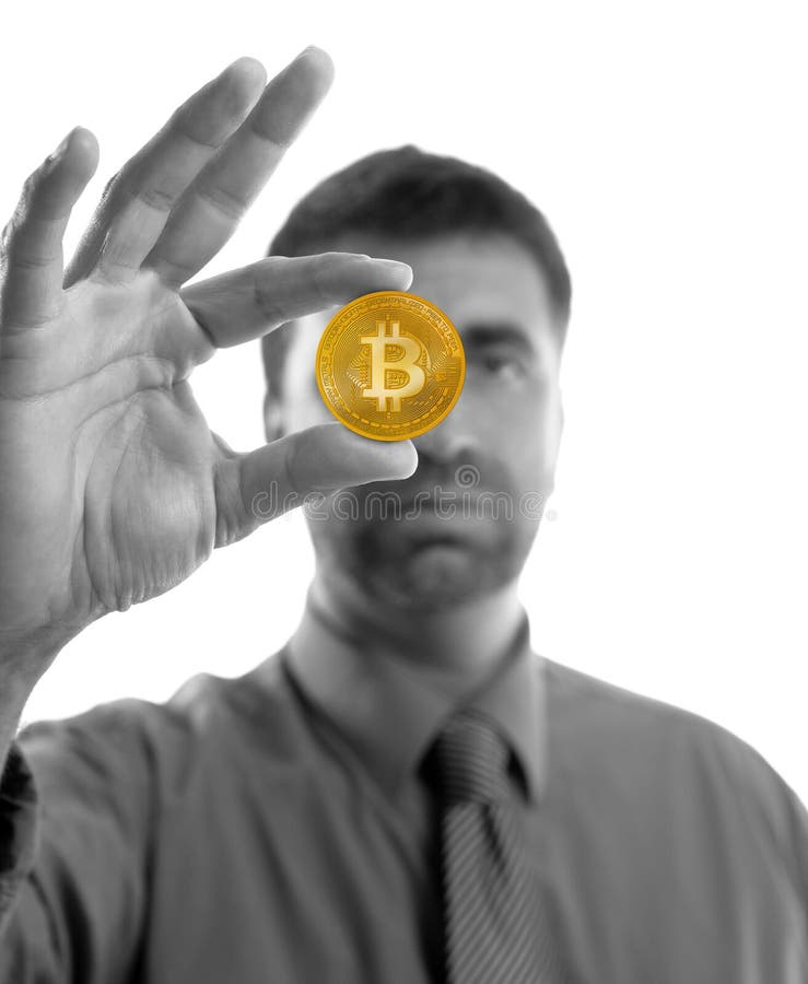 Businessman holding Bitcoin currency in hands royalty free stock photo