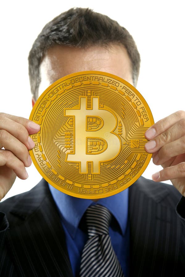 Businessman holding Bitcoin currency in hands royalty free stock images
