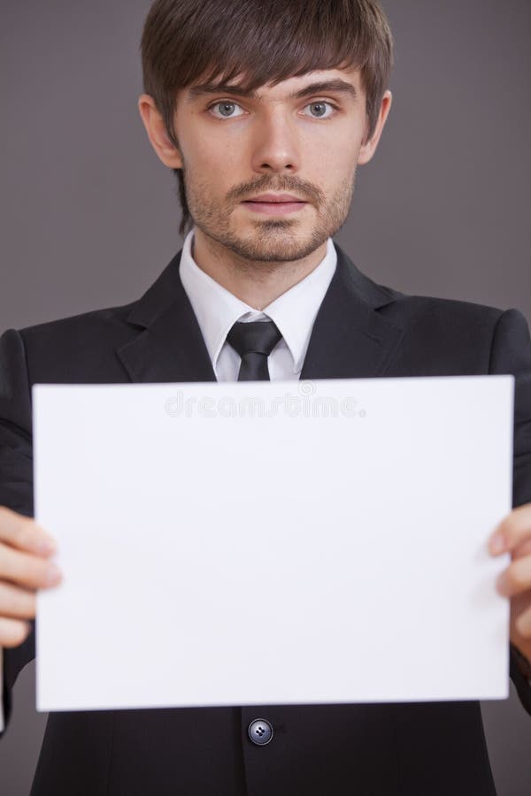 Businessman holding blank board