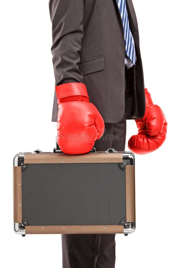 Businessman holding a briefcase with red boxer gloves