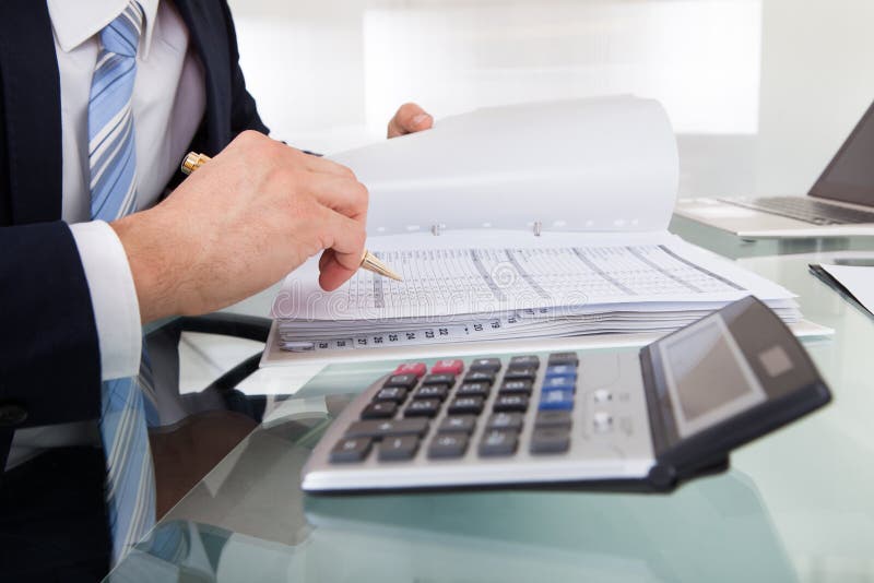Businessman Holding Calculating Expense in Office Stock Image Image