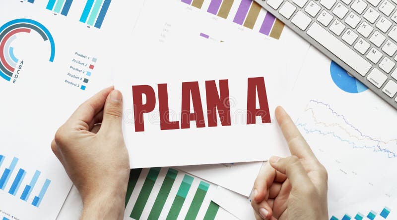 Businessman holding a card with text PLAN A. Keyboard, diagram and white background stock image