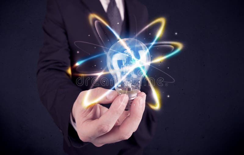 Businessman holding a colorful light bulb