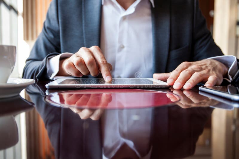 Businessman holding digital tablet, hands multitasking man using tablet stock photos Businessman holding digital tablet, hands multitasking man using tablet stock photos