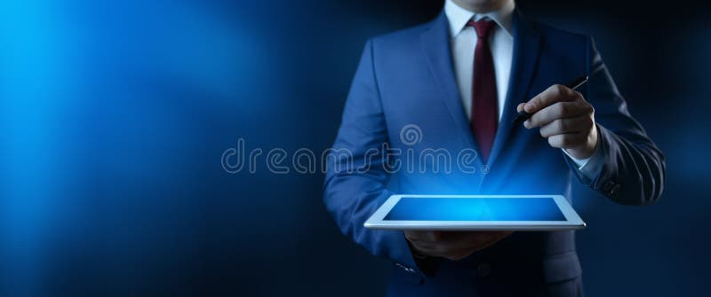 Businessman holding digital tablet. Man using gadget in office royalty free stock image Businessman holding digital tablet. Man using gadget in office royalty free stock image