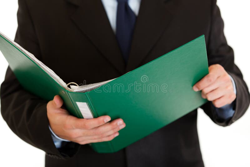 Businessman holding folder with documents in hand isolated on white. Close-up. Businessman holding folder with documents in hand isolated on white. Close-up.