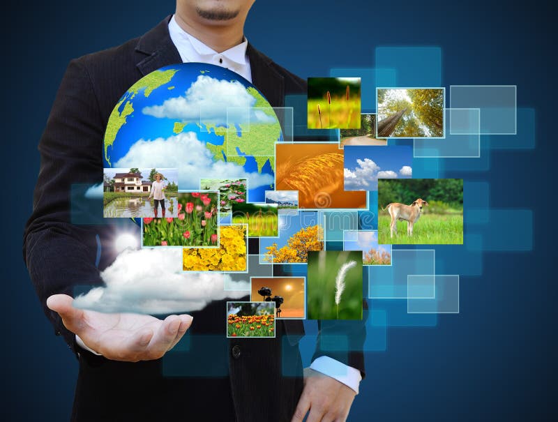 Businessman holding green Earth in hands