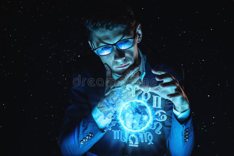 Businessman holding hands over the magic sphere with a horoscope to predict the future. Astrology as a business stock photography Businessman holding hands over the magic sphere with a horoscope to predict the future. Astrology as a business stock photography
