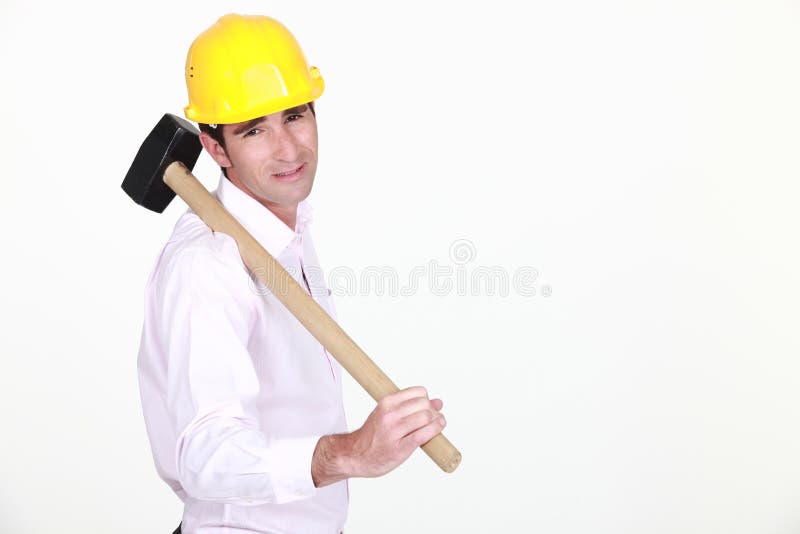 Businessman holding a helmet royalty free stock image