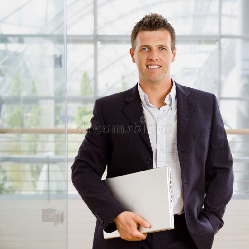 Businessman holding laptop