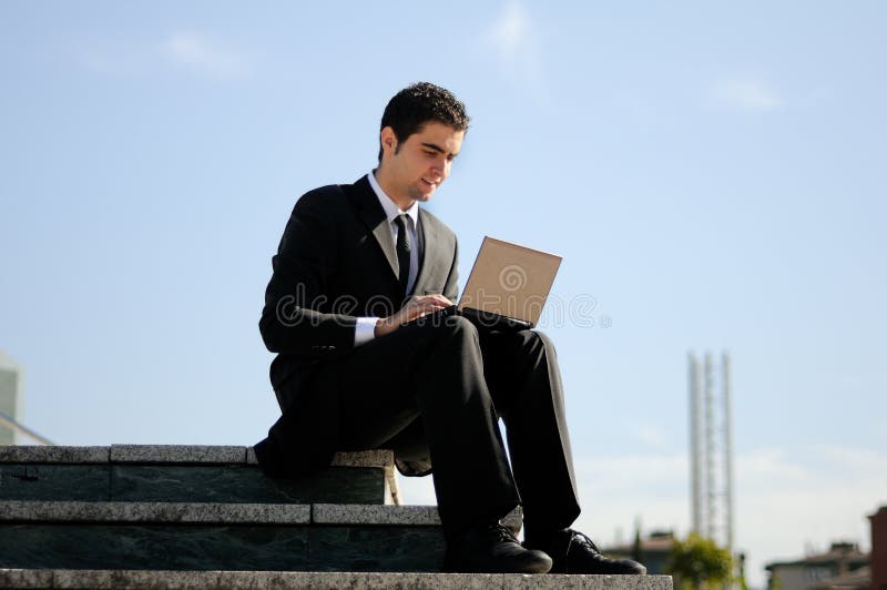 Businessman holding a laptop computer