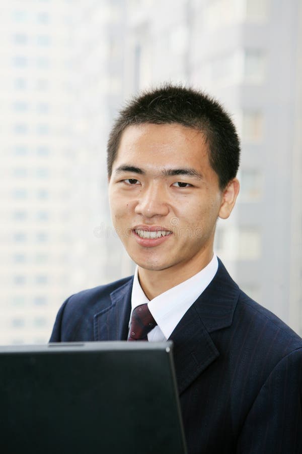 Businessman holding laptop computer
