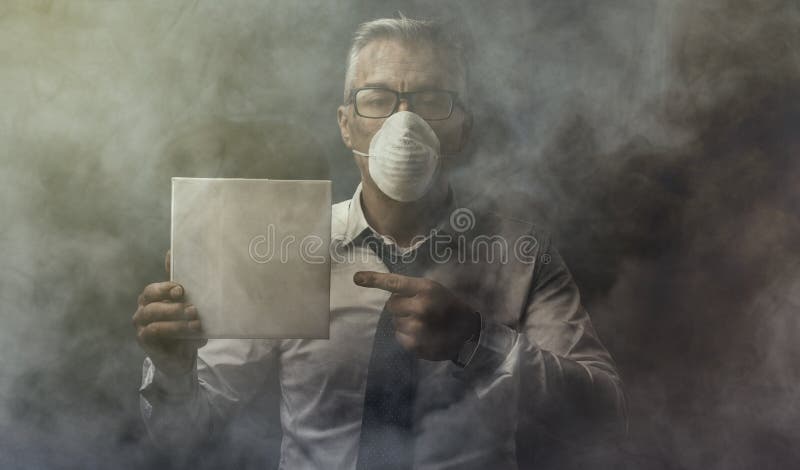 Businessman holding a sign and air pollution