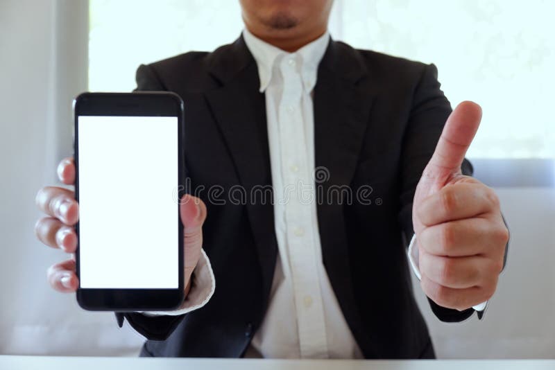 Businessman holding smartphone forward empty white screen for your text or picture stock photos Businessman holding smartphone forward empty white screen for your text or picture stock photos