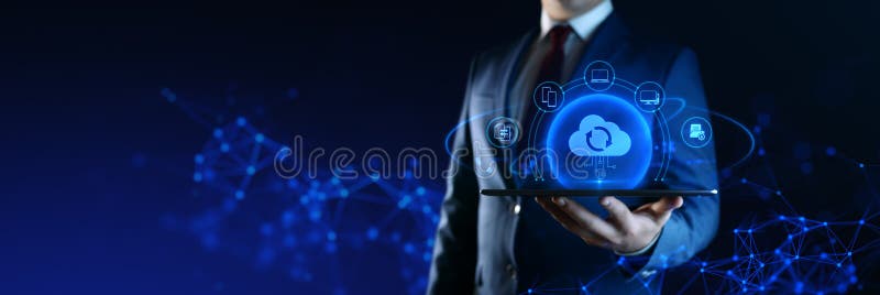 Businessman Holding tablet with Cloud Computing Icons on Screen. Data transfer and Cloud Backup technology royalty free stock image