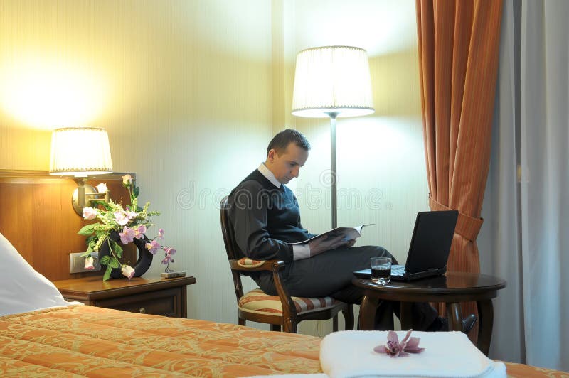 Businessman in a hotel room royalty free stock photography