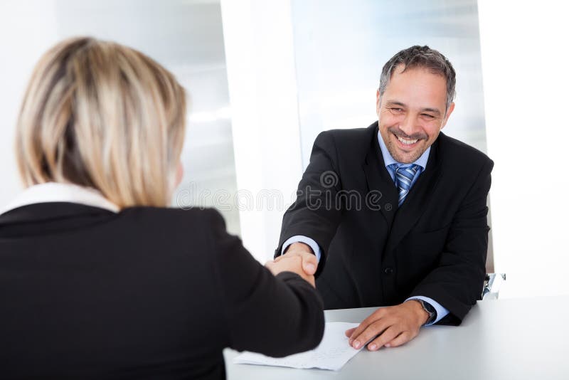 Businessman at the interview shaking hands royalty free stock photos