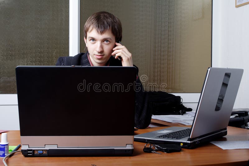 Businessman with Laptops