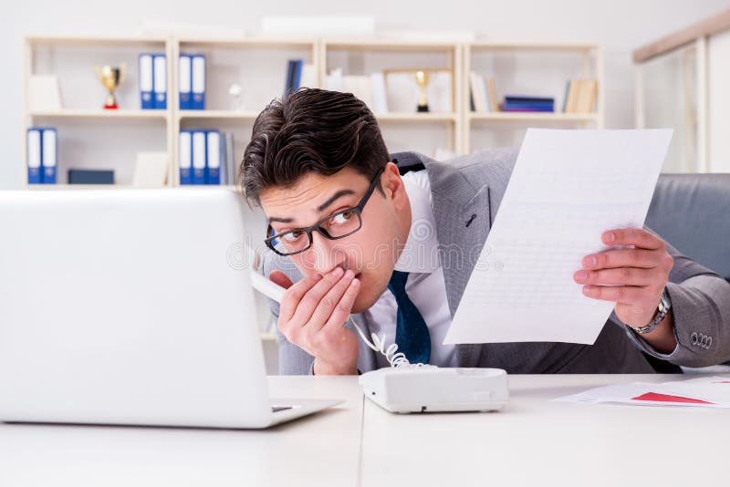 The businessman leaking confidential information over phone stock photo The businessman leaking confidential information over phone stock photo