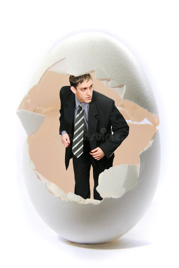 Businessman look out big egg