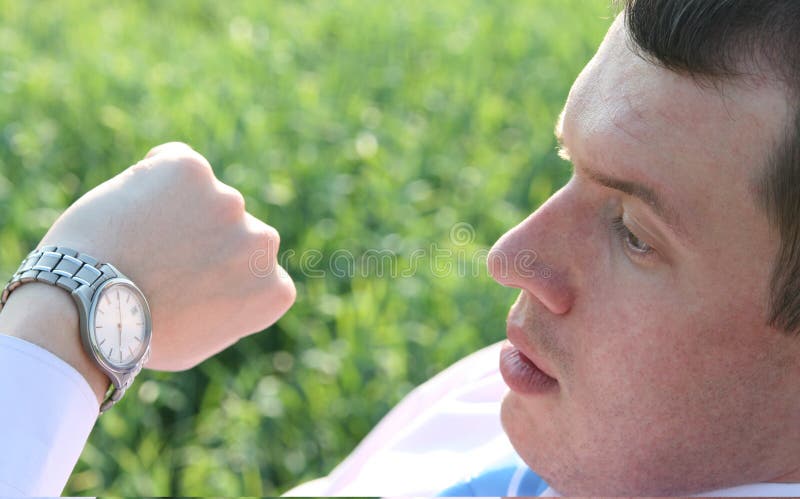 Businessman looking at watch