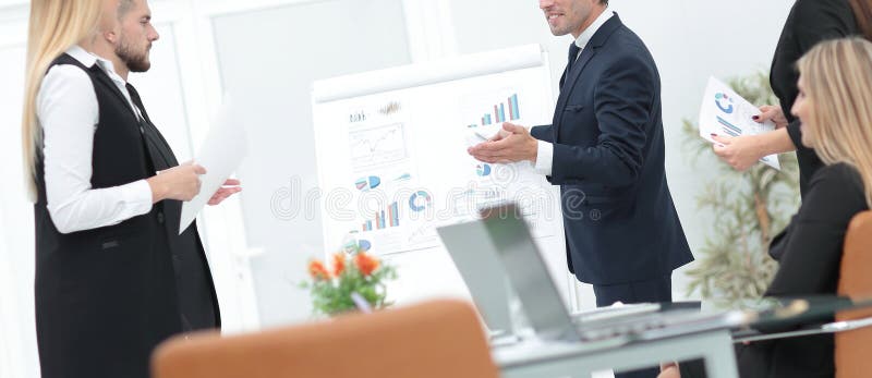 Businessman makes a presentation to his business team