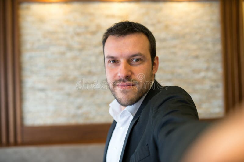 Businessman making selfie stock photos