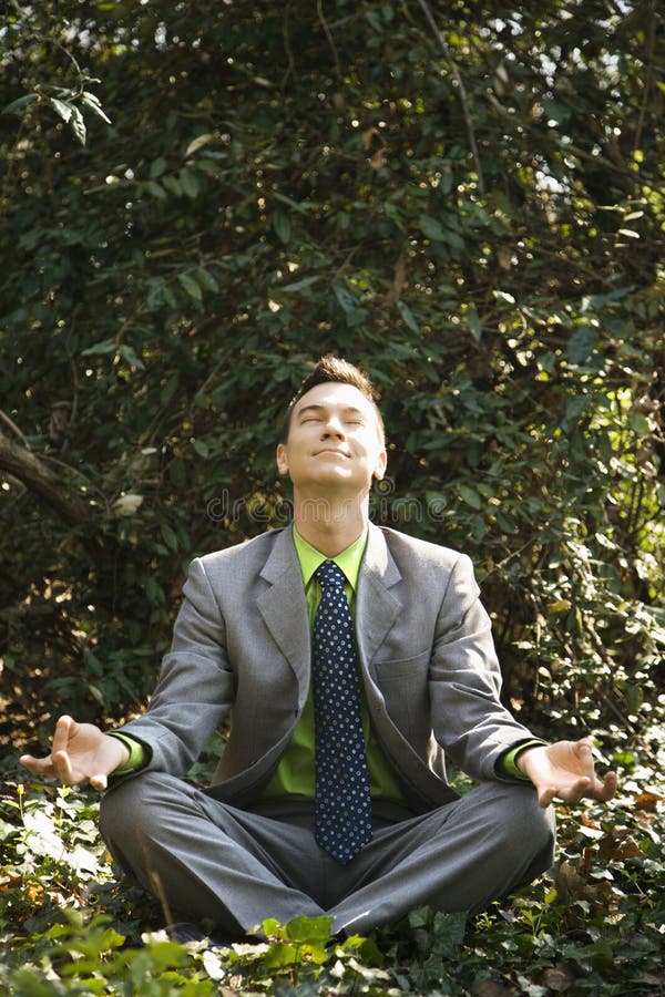 Businessman in Meditation Outside royalty free stock images Businessman in Meditation Outside royalty free stock images