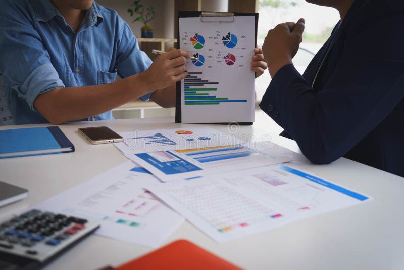 Businessman meeting with new startup project pointing graph discussion and analysis data charts and graphs.Business finances and