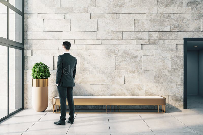 Businessman in modern gallery with empty copyspace