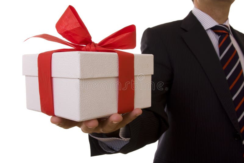 A businessman offering a gift to you (selective focus). Male hand holding businessman stock images, royalty-free photos and pictures