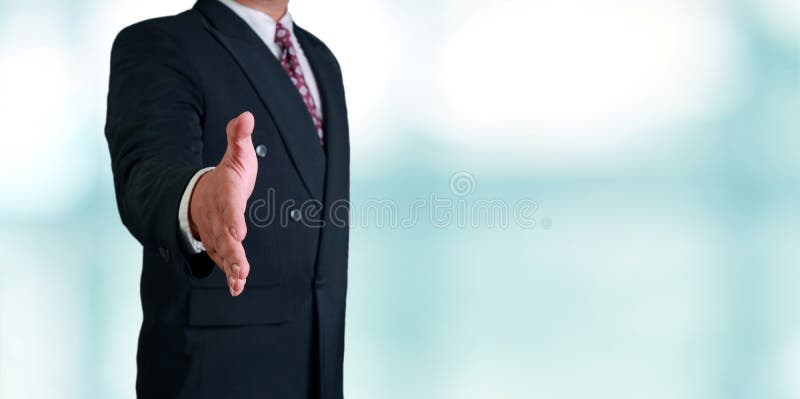 Businessman Offering Hand Shake. Business concept image of a businessman offering hand shake over bright background royalty free stock photos Businessman Offering Hand Shake. Business concept image of a businessman offering hand shake over bright background royalty free stock photos