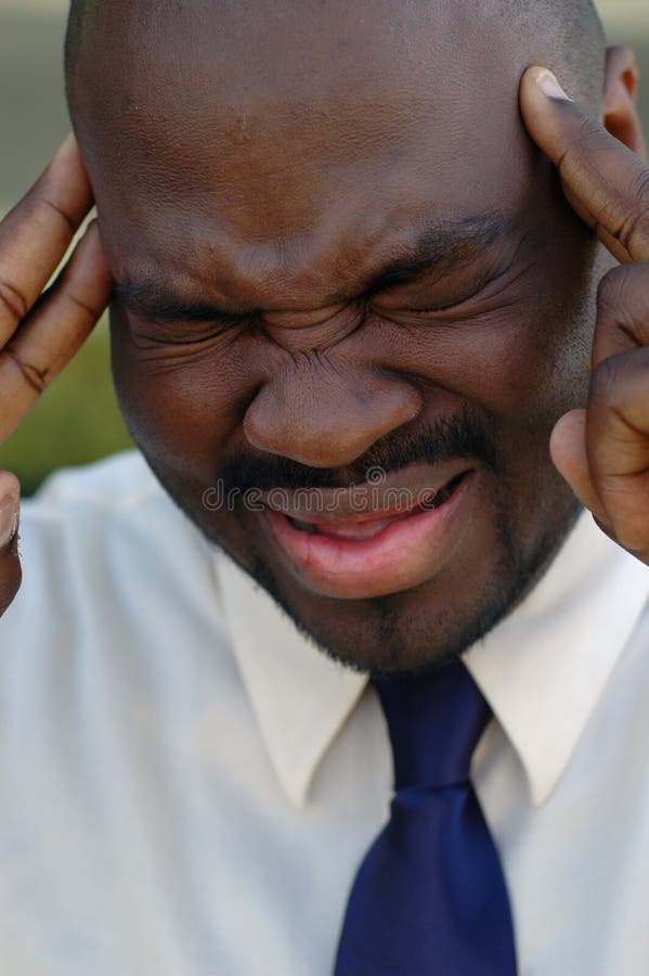 Young businessman in a whole lot of trouble. Male hand holding businessman stock images, royalty-free photos and pictures