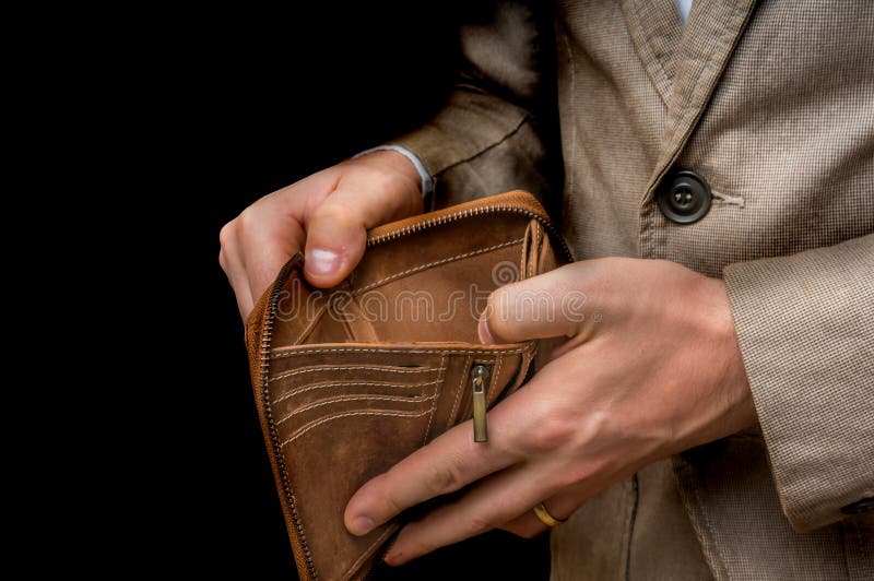 Man hand open the brown handmade leather empty wallet on white background  Stock Photo