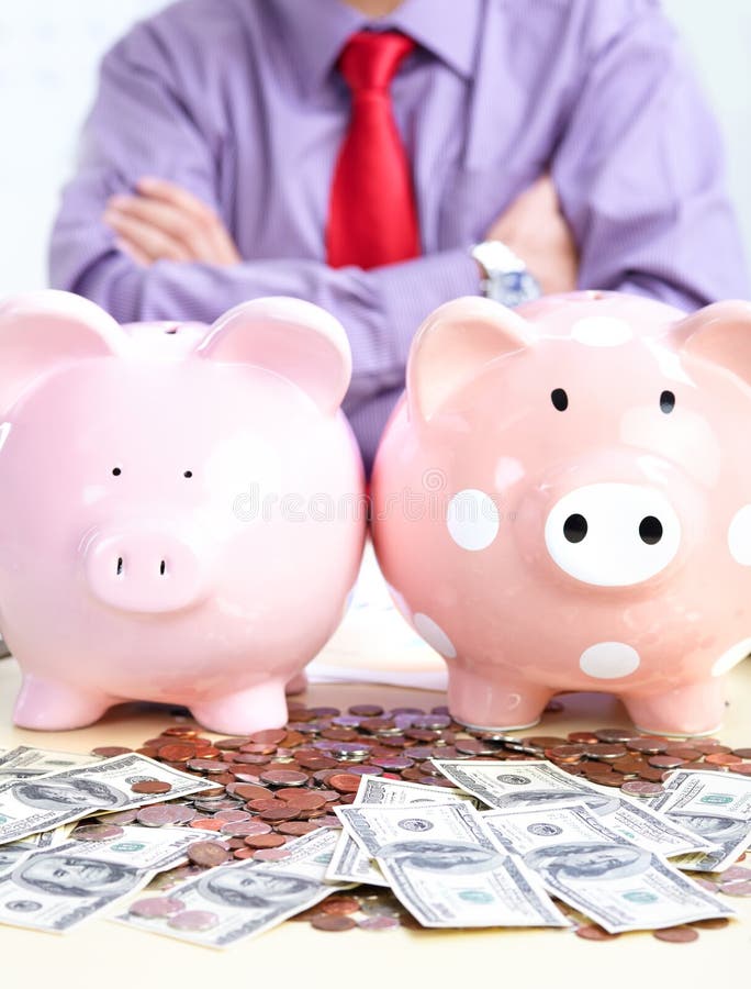 Businessman with a pig bank