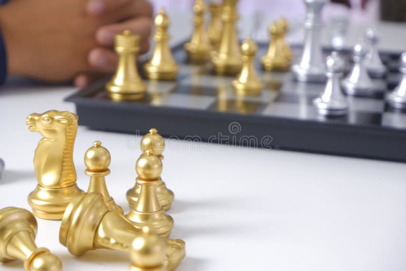 Businessman playing chess game; for business strategy, leadership and management concept stock images Businessman playing chess game; for business strategy, leadership and management concept stock images