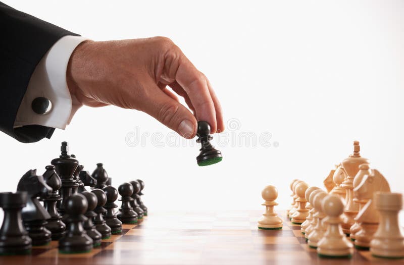 Businessman playing chess game selective focus stock photos Businessman playing chess game selective focus stock photos