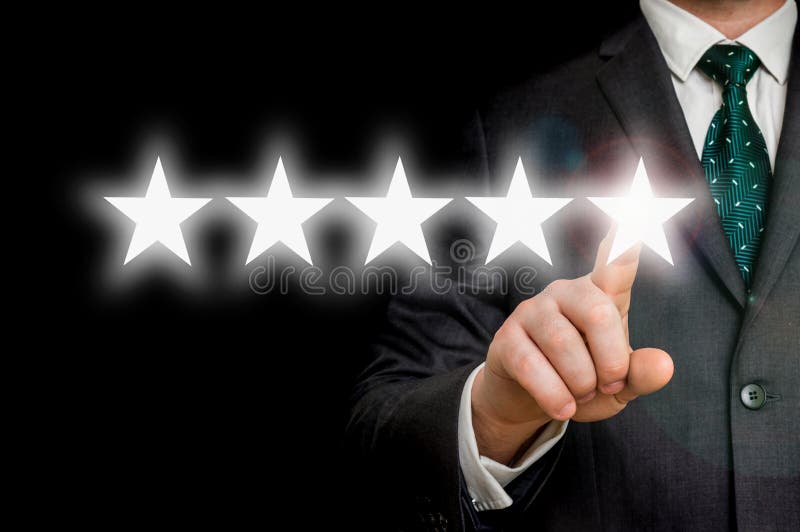 Successful businessman is pointing five stars - review and rating concept