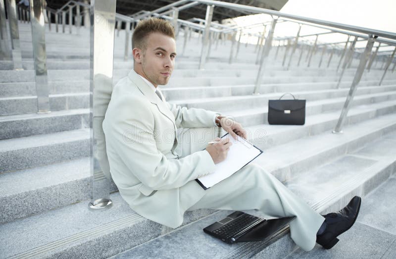 Businessman portrait on stairs