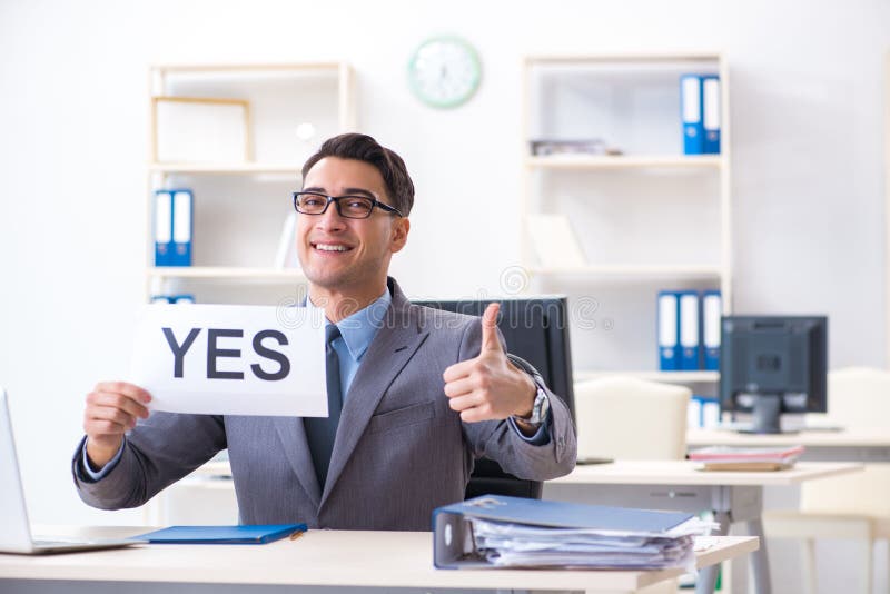 The businessman in positive yes answer in the office