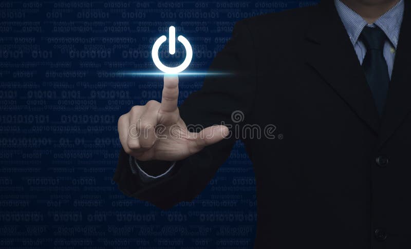 Businessman pressing power button over computer binary code blue royalty free stock images Businessman pressing power button over computer binary code blue royalty free stock images