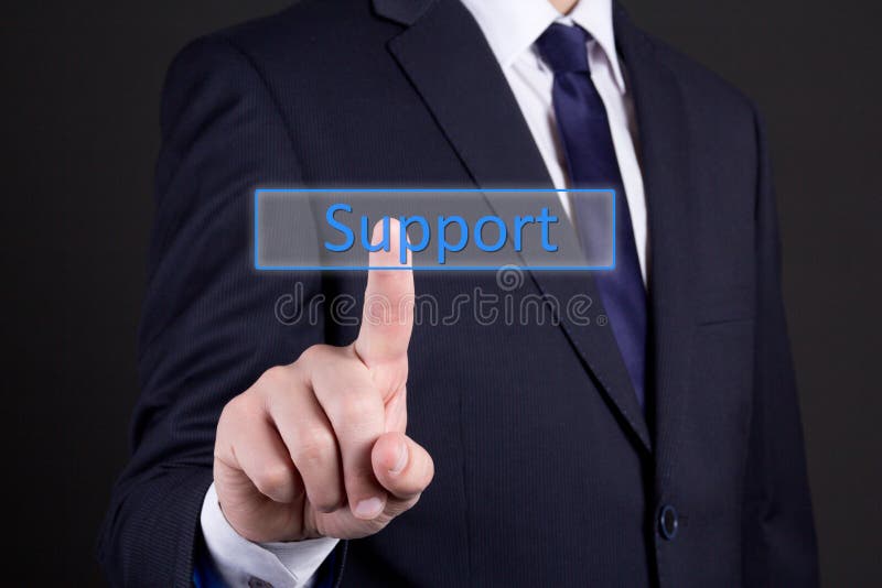 Businessman pressing support button over dark background royalty free stock photos Businessman pressing support button over dark background royalty free stock photos